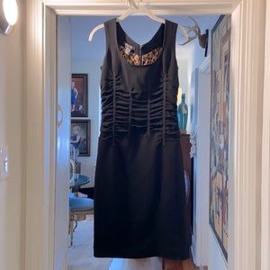 Black cocktail dress with leopard lining. Size 2